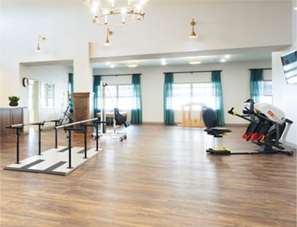 Interior view of a therapy room with exercise equipment