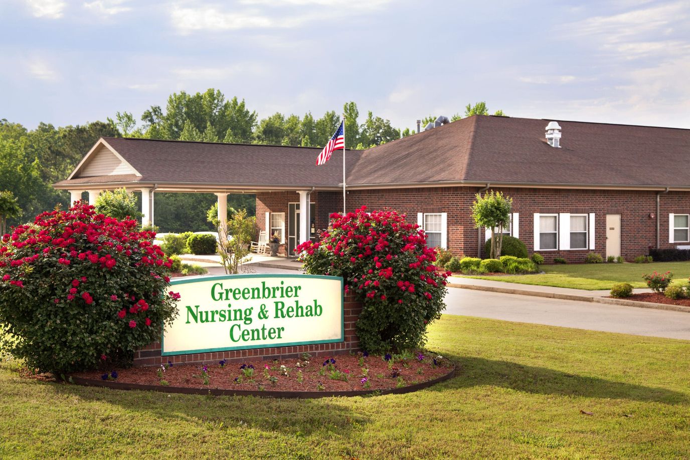 Exterior view of nursing and rehab center with landscaping