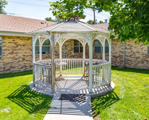 A gazebo in a green outdoor space