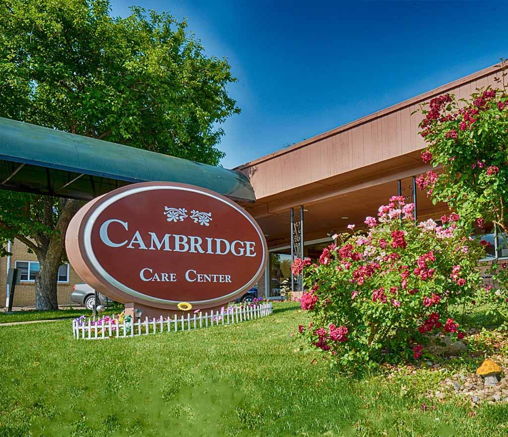 Exterior view of Cambridge Care Center with flowers