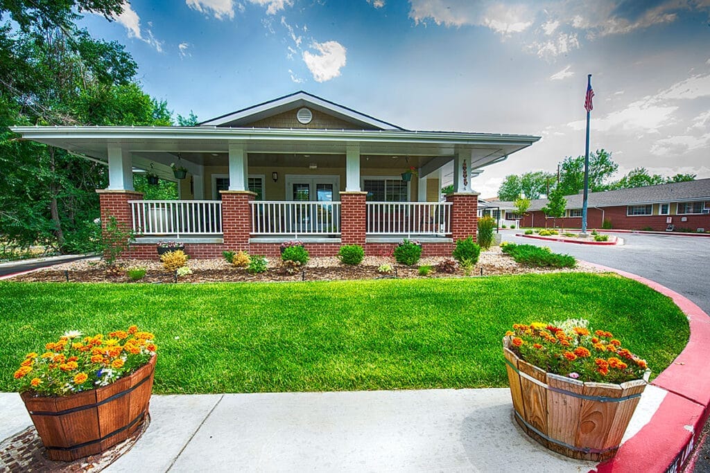 Exterior view of a senior living facility with landscaping