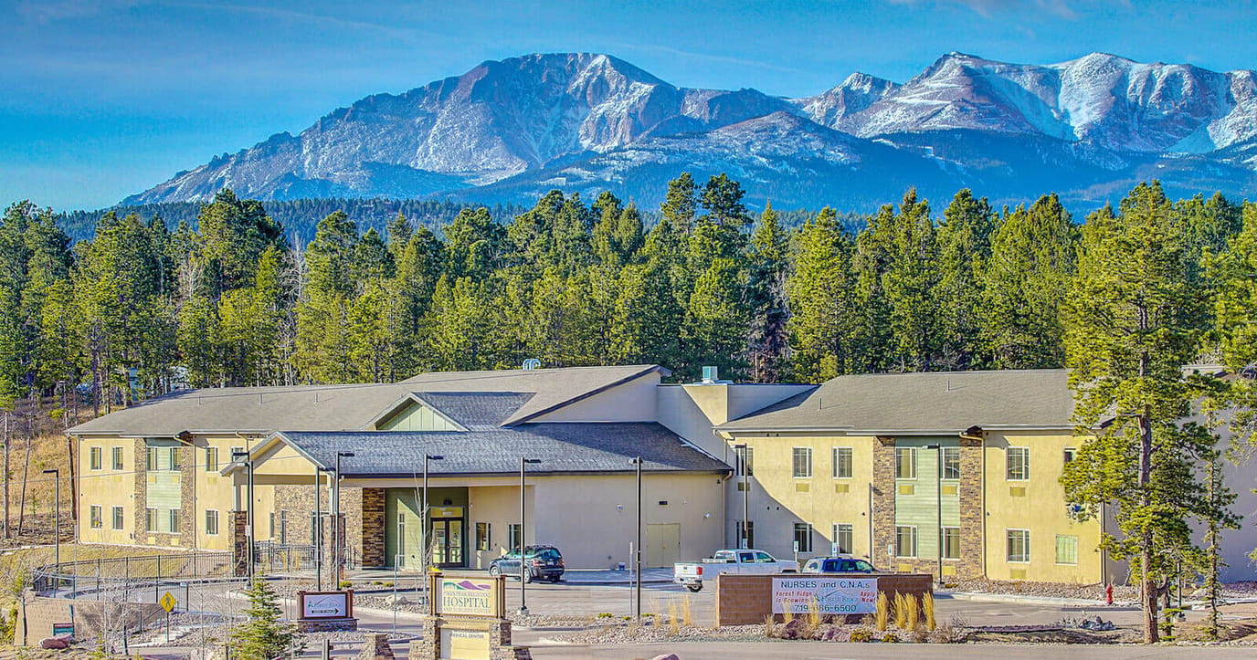 Building exterior with mountains in the background