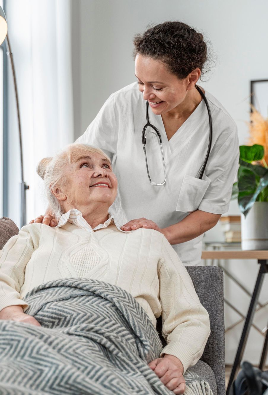 Healthcare worker smiling with a resident
