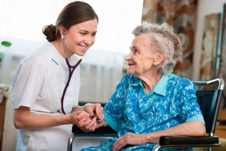 A caregiver interacting with an elderly resident.