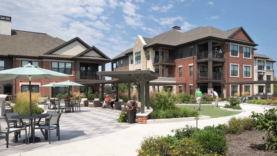 Outdoor space with seating and nearby residents