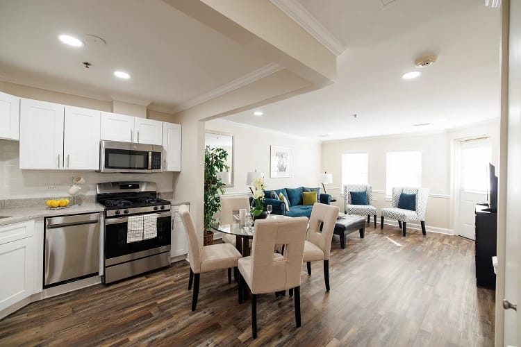 Stylish common area with kitchen and seating
