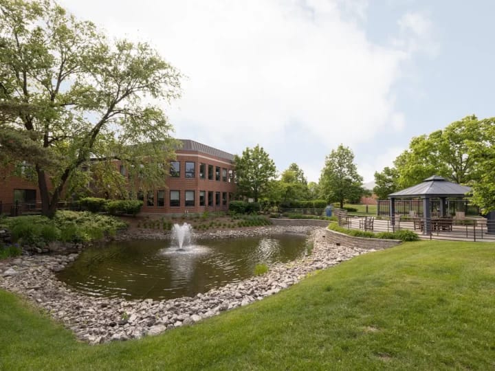 Scenic view of the facility's outdoor space with a pond