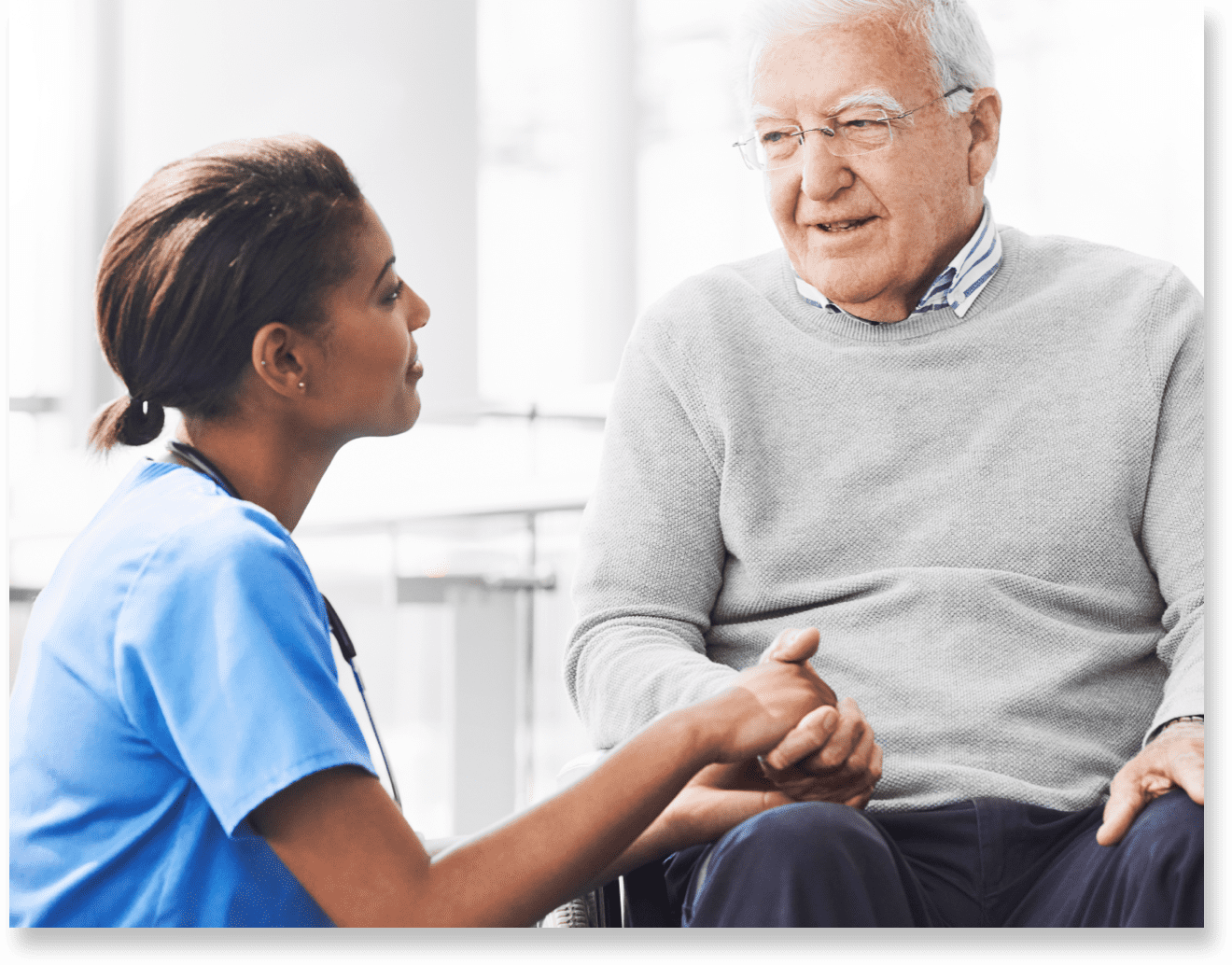 Nurse interacting with senior resident in care center