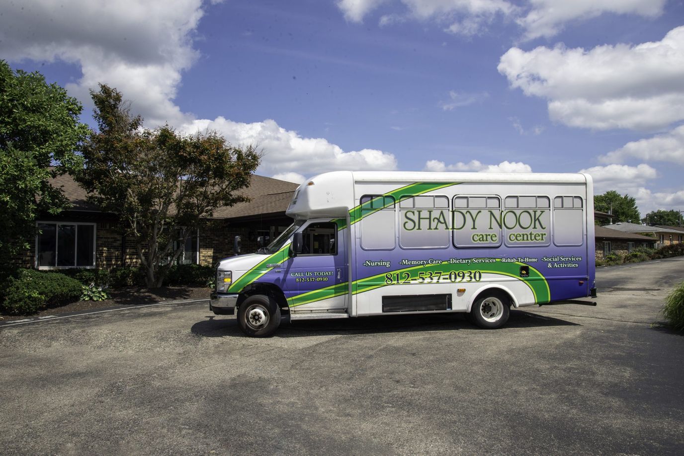 Facility shuttle bus parked outside the building