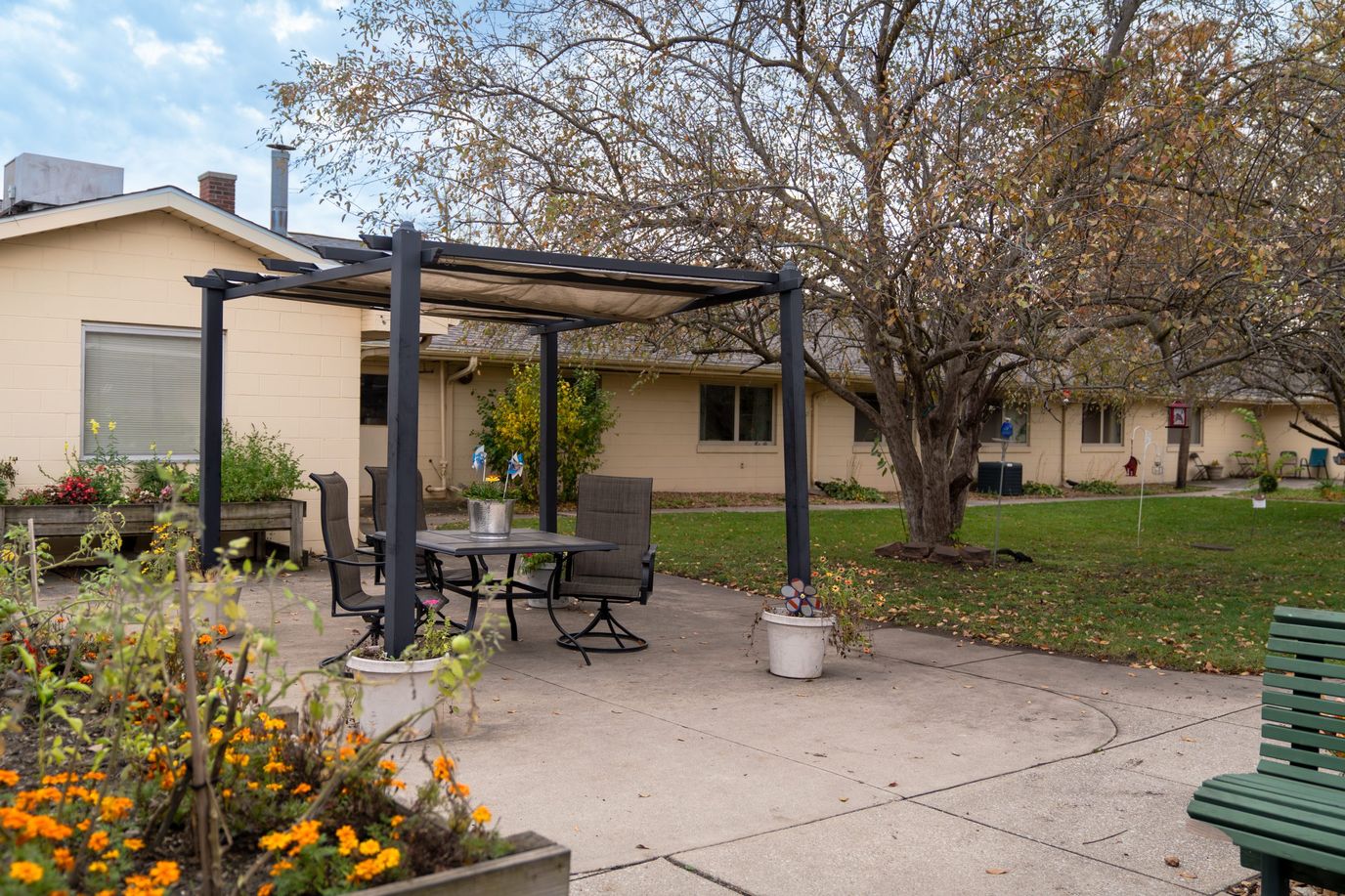 Outdoor seating area with a pergola and garden