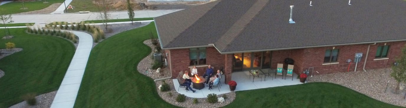 Residents enjoying an outdoor fire pit gathering