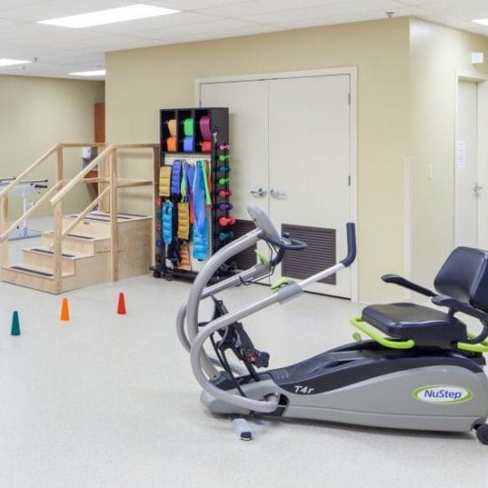 Exercise equipment in a well-lit activity room