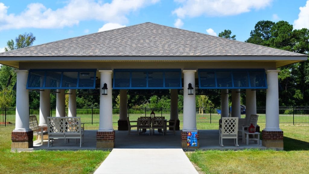Outdoor covered seating area with benches