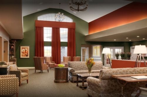 Bright common area with comfortable seating and windows