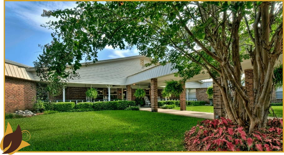 Exterior view of a senior living facility with landscaping