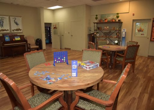 Interior activity room with tables and games