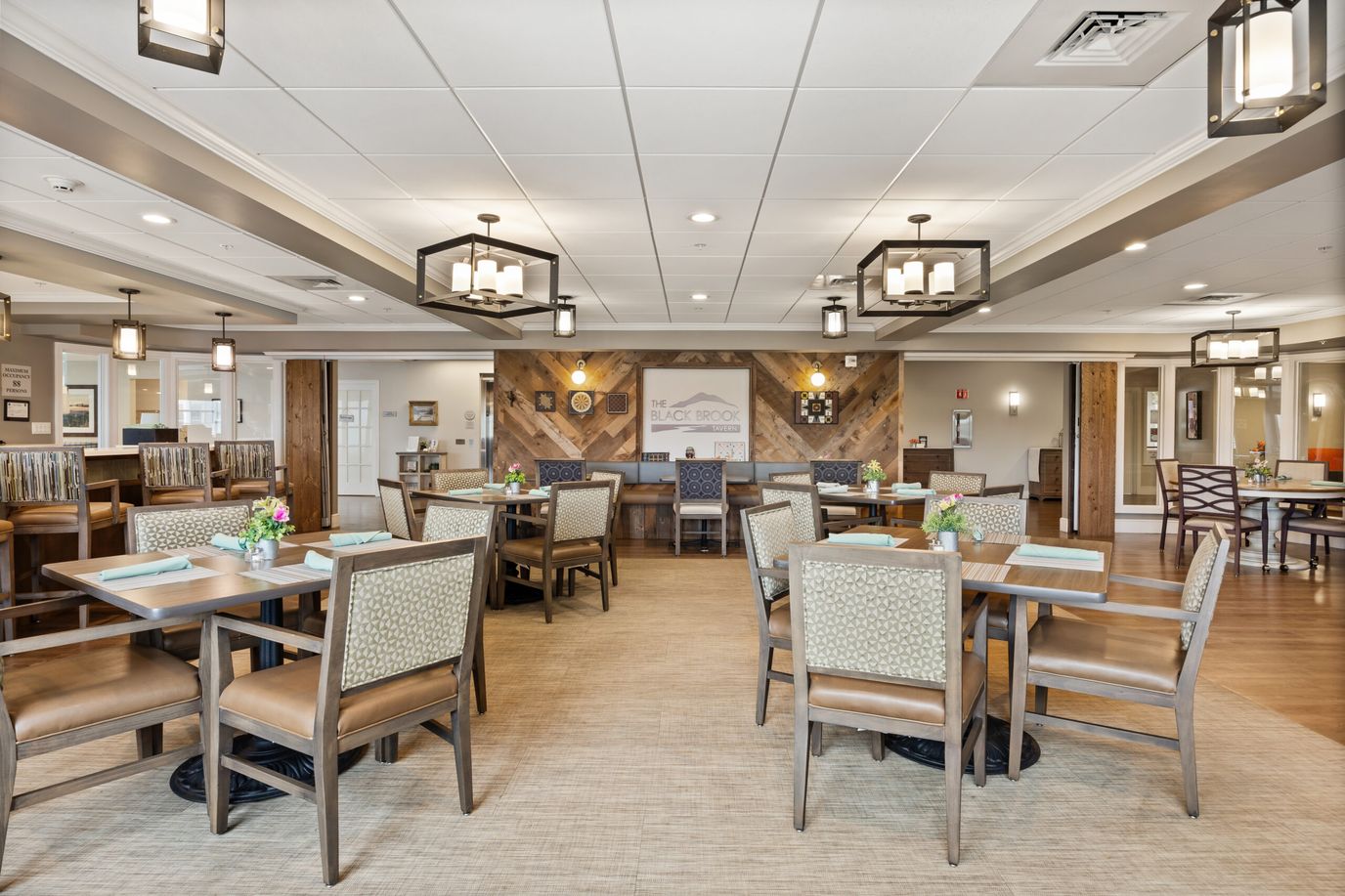 Bright interior dining area with tables and chairs