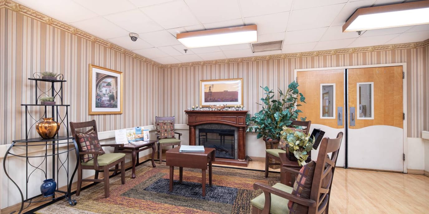 Cozy common area with seating and a fireplace