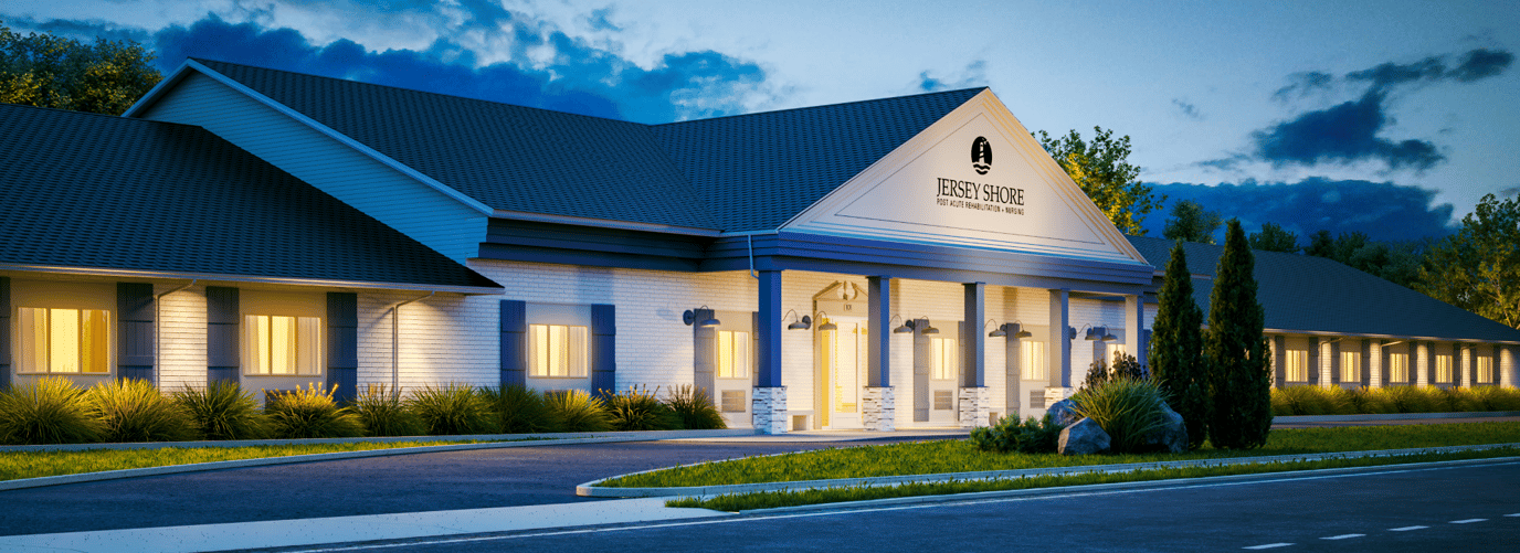 Exterior view of a senior living facility at dusk