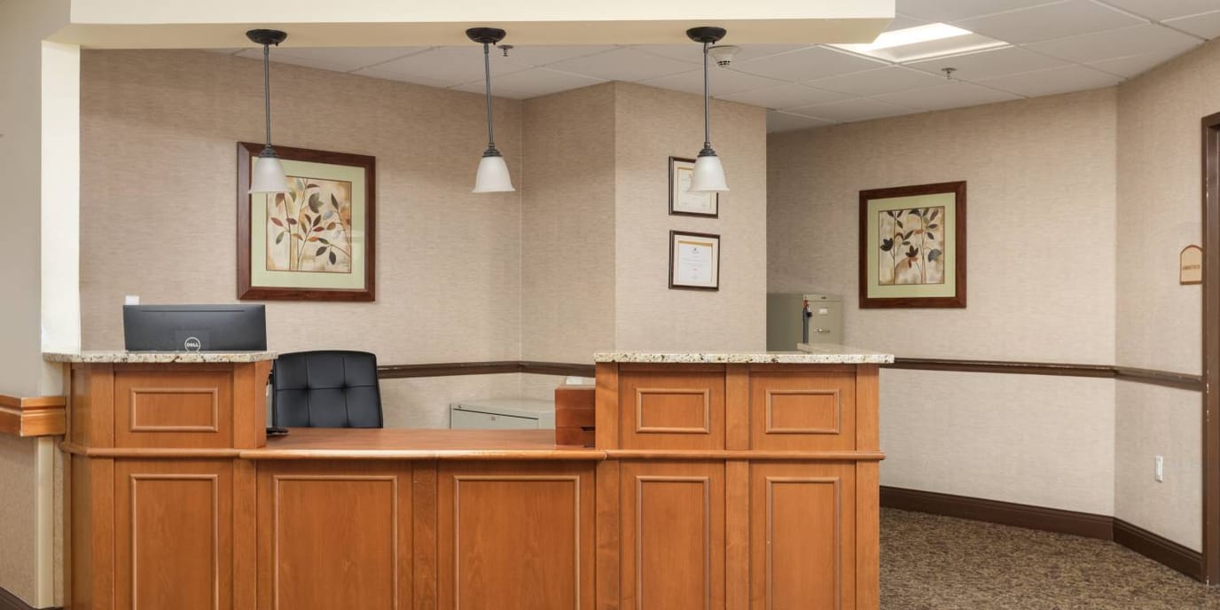 Reception area with desk and framed artwork