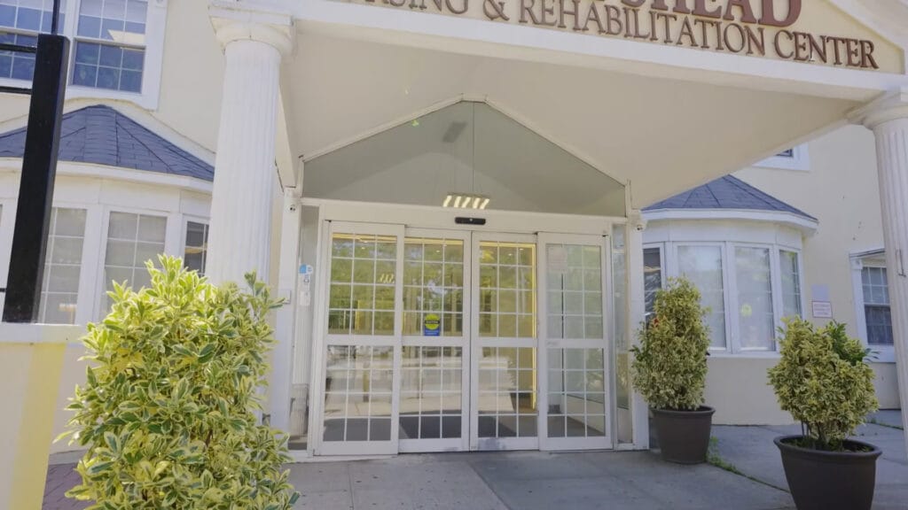 Entrance of a nursing and rehabilitation center with glass doors