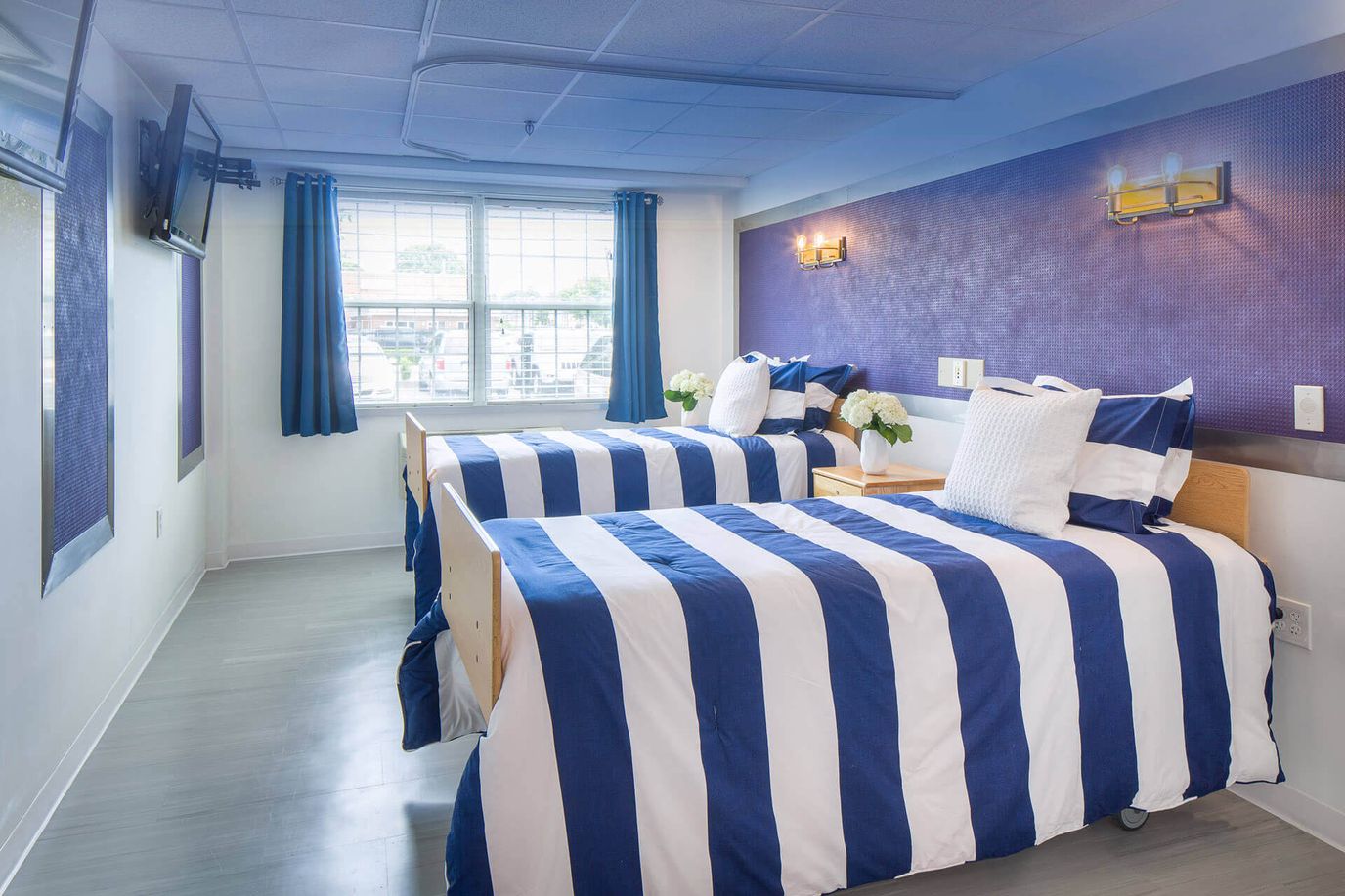 Interior view of a shared resident bedroom with two beds