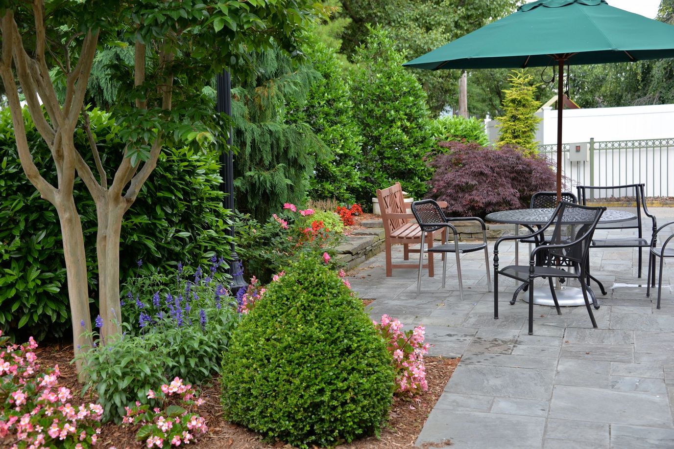 Picturesque outdoor seating area with vibrant flowers