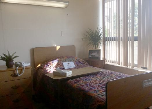 Cozy resident room with bed and personal items