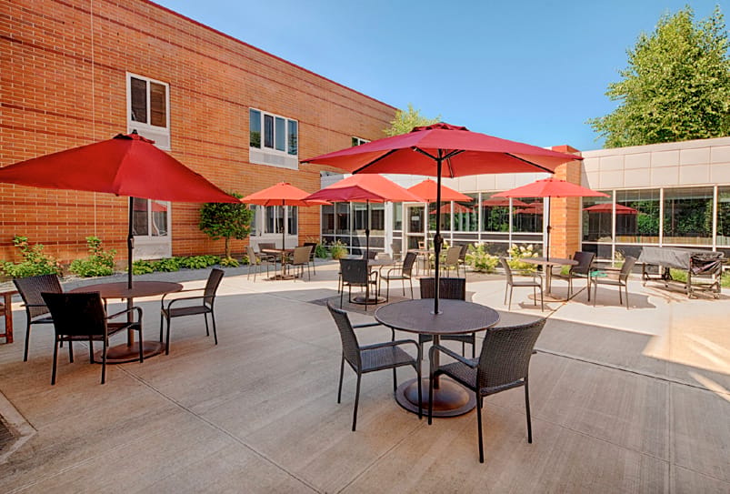 Outdoor patio with tables and umbrellas