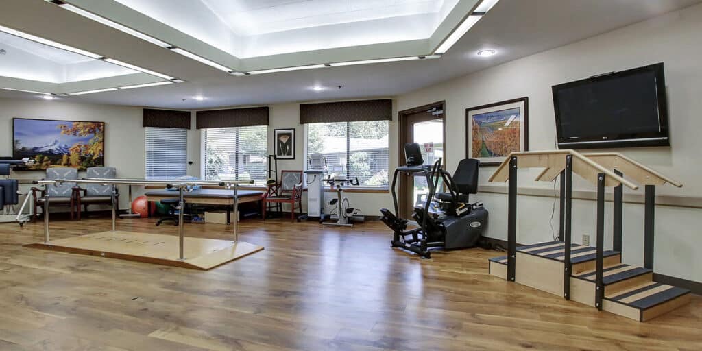 Interior view of a physical therapy room with equipment