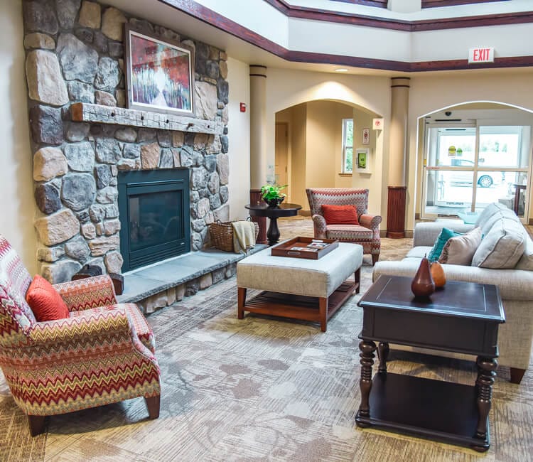 Cozy lobby area with seating and a fireplace