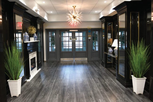Bright lobby area with decorative lighting and plants