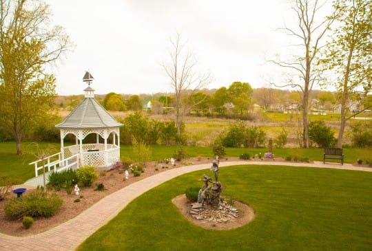 Beautiful landscaped garden with gazebo and path