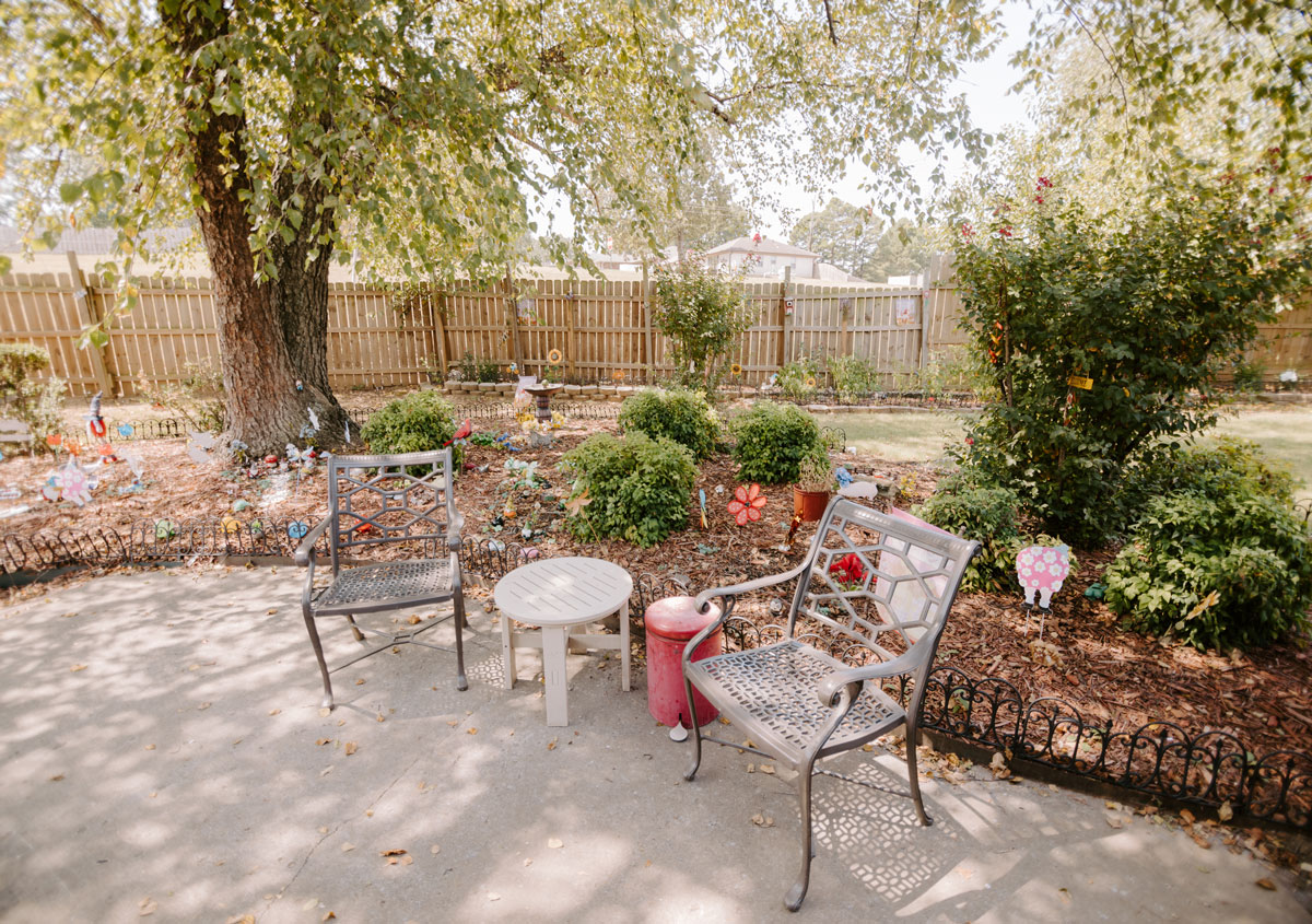 A serene garden area with chairs and decorations