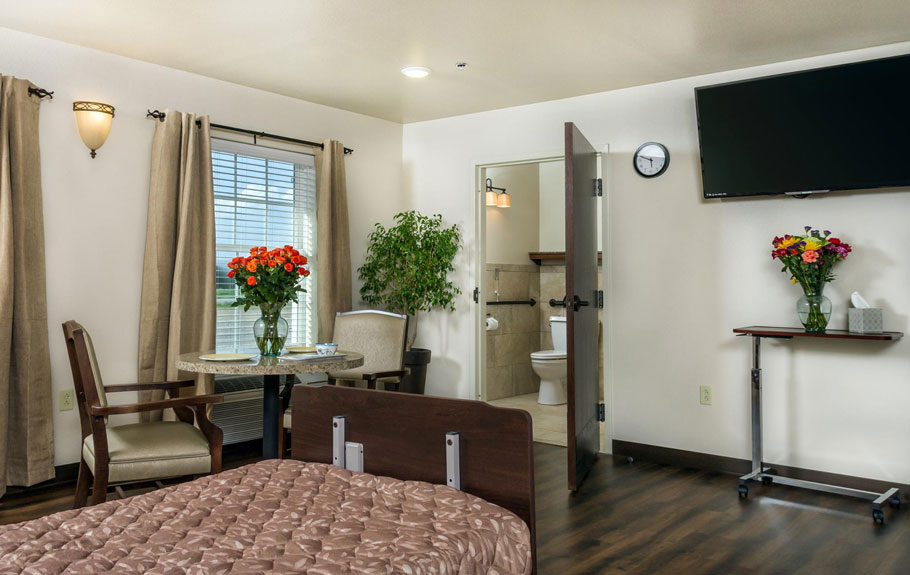 Cozy individual resident room with flowers and a clock