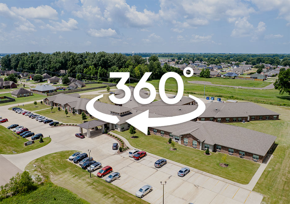 Aerial view of a senior living facility with parking