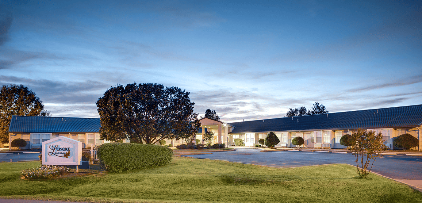 Exterior view of assisted living facility at twilight