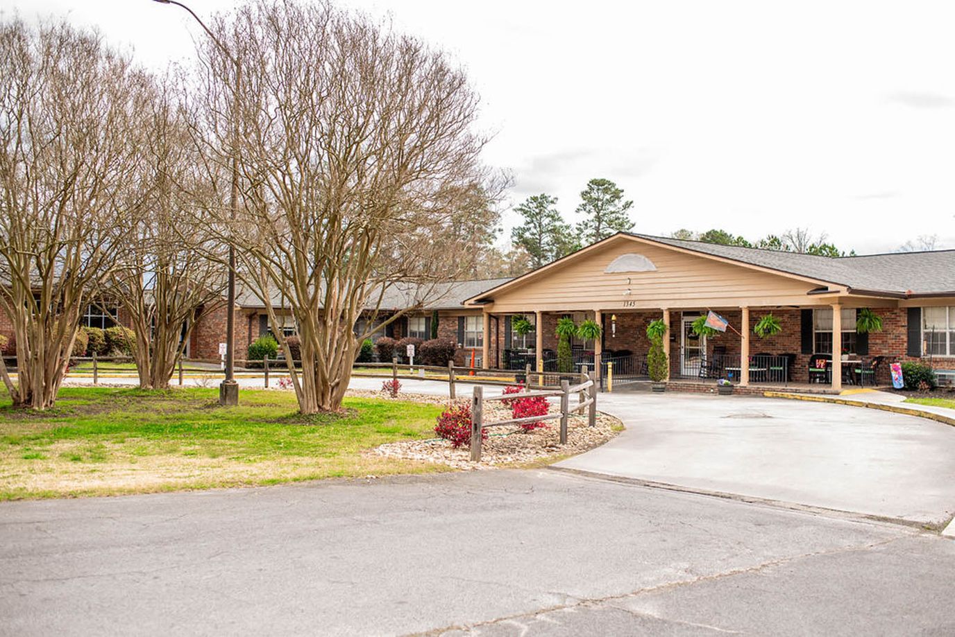 Exterior view of a senior living facility with landscaping