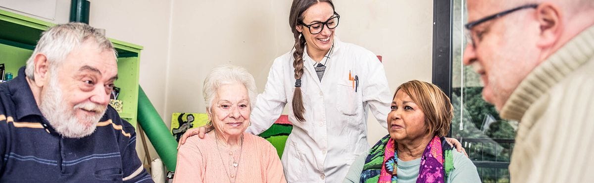 Residents enjoying a group activity with staff
