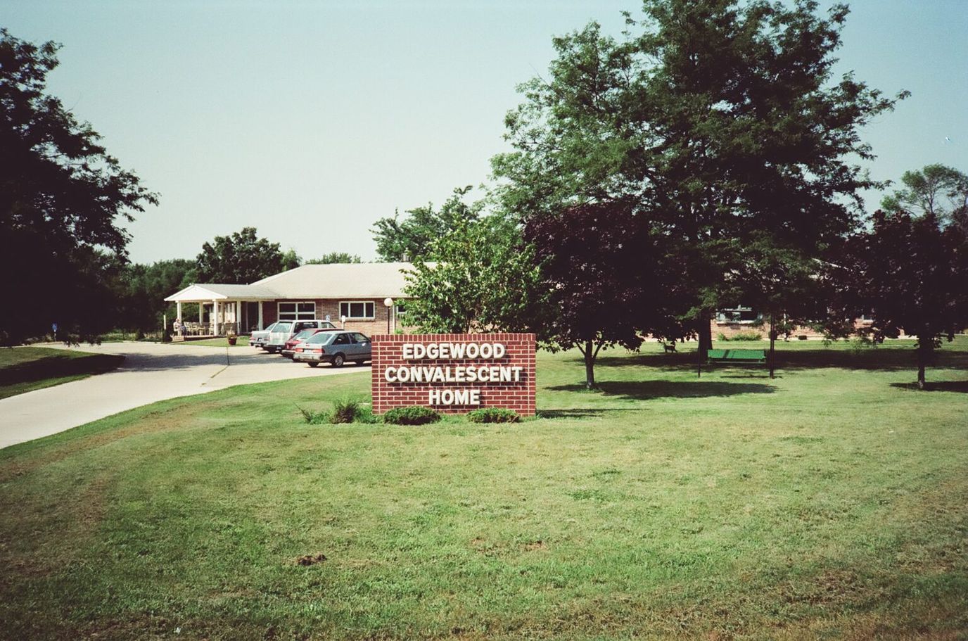 Exterior view of Edgewood Convalescent Home with signage