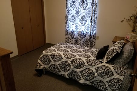 Private resident room with bed and window
