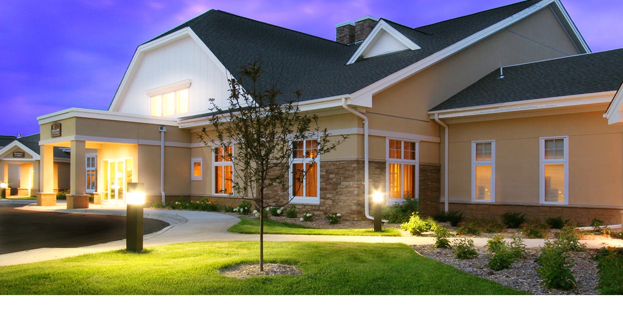 Exterior view of a senior facility at dusk