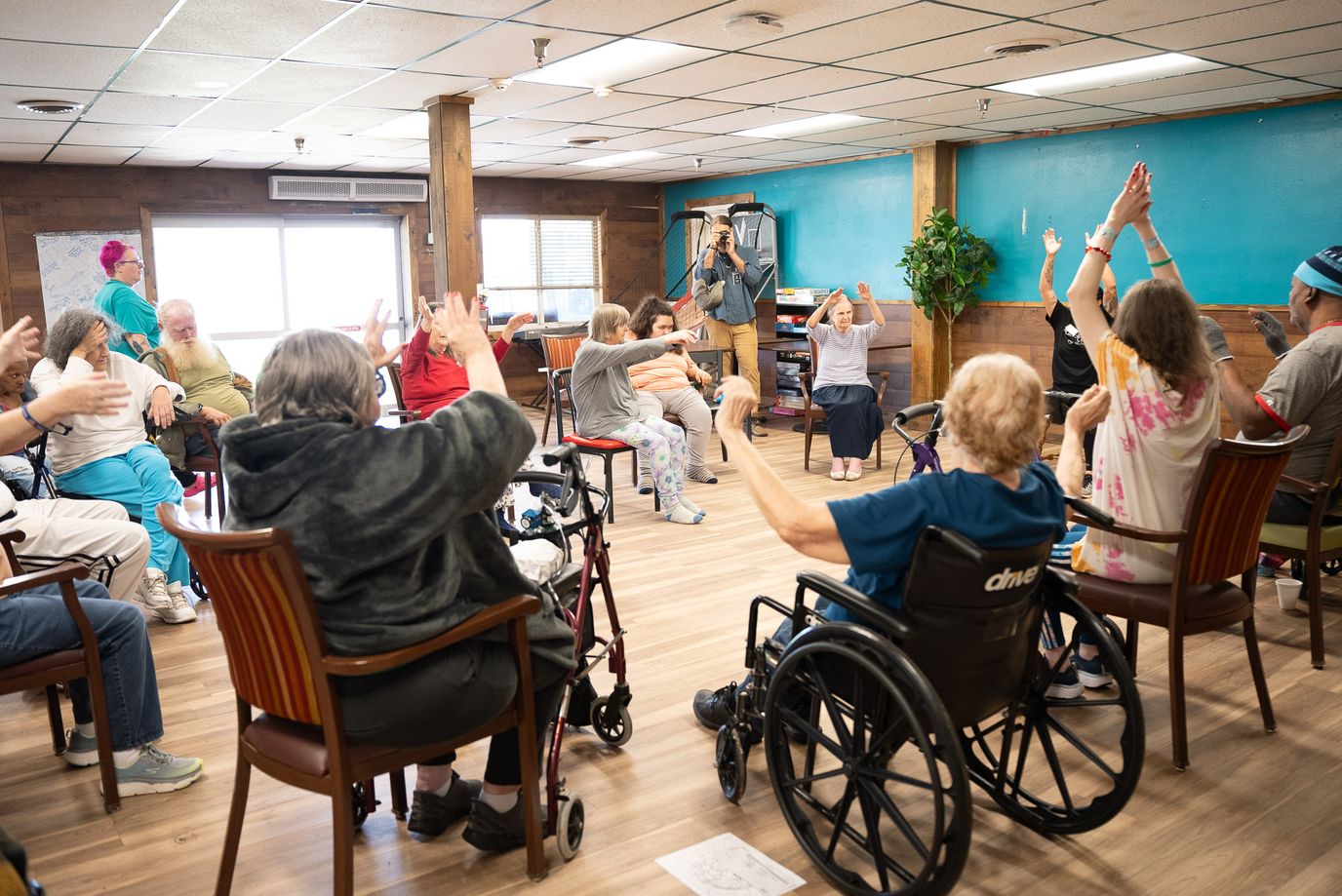 Residents participating in an activity session in a common room