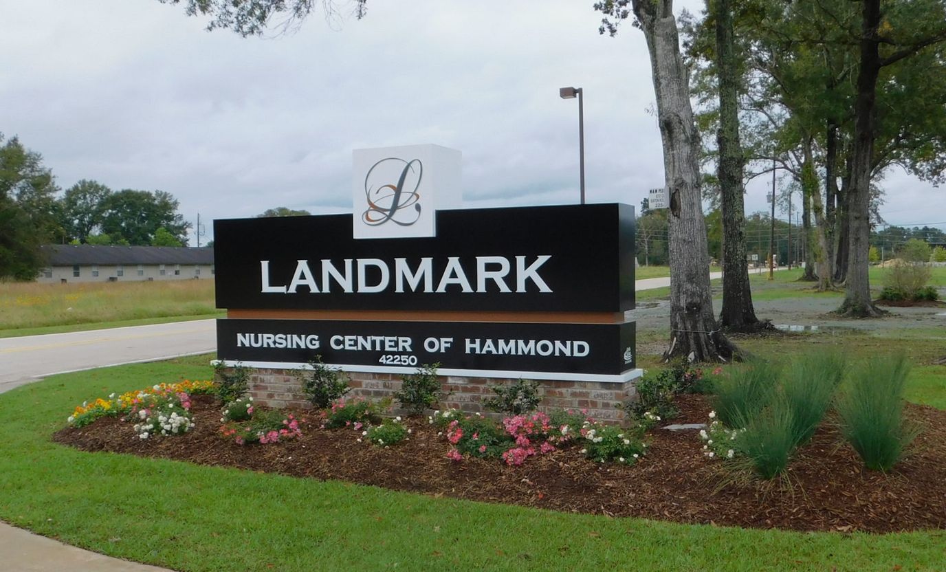 Signage for Landmark Nursing Center with landscaping