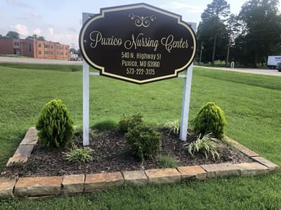 Sign for Puxico Nursing Center outside on the lawn