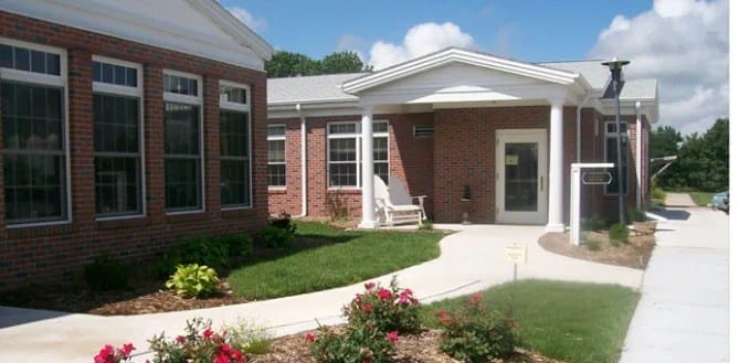 Fairview Manor, Nursing Home in Fairmont, NE — Entrance of a senior living facility with landscaping