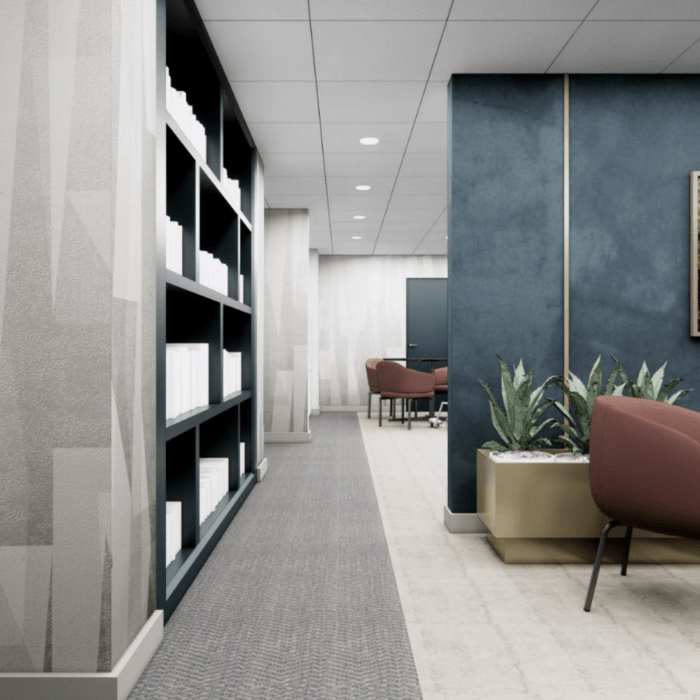 Well-lit interior hallway with seating and plant decor
