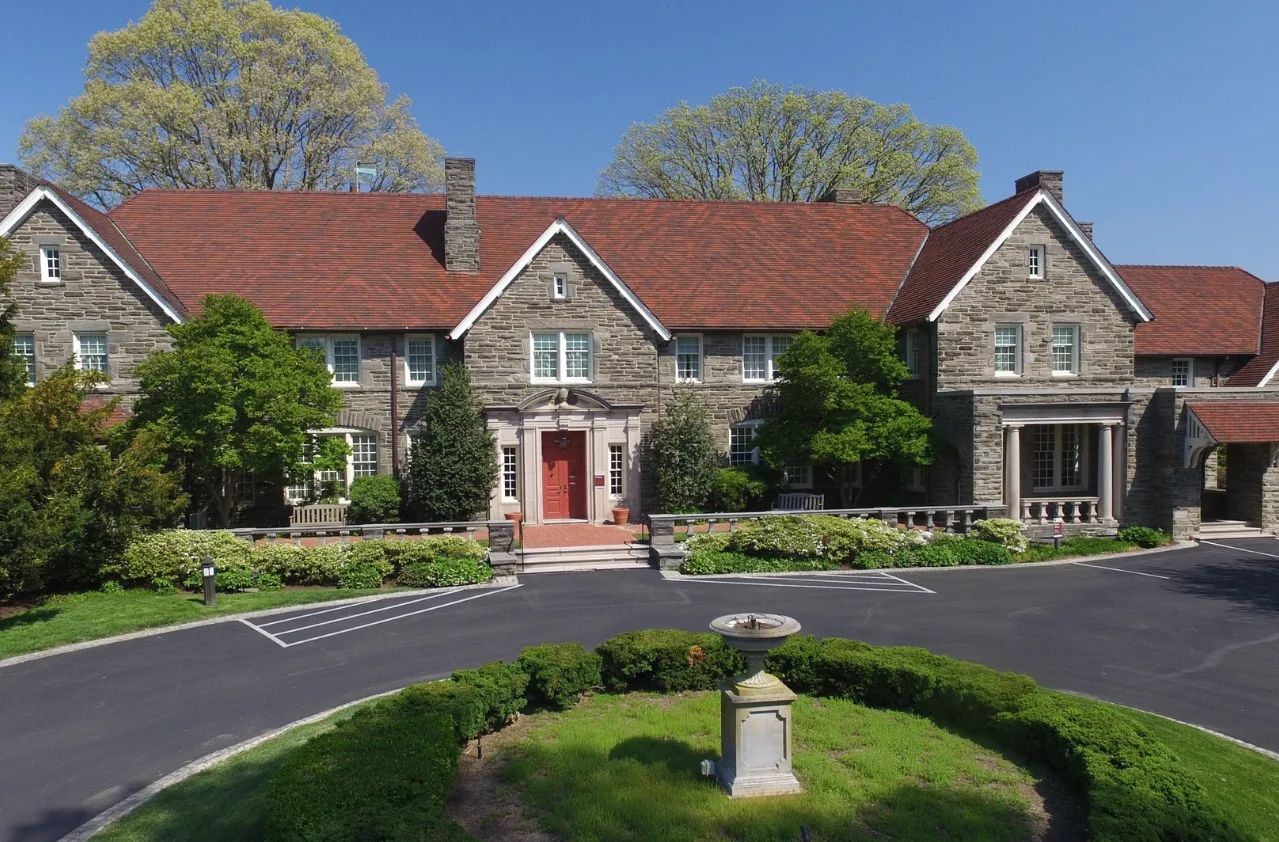 Exterior view of a senior living facility with landscaping