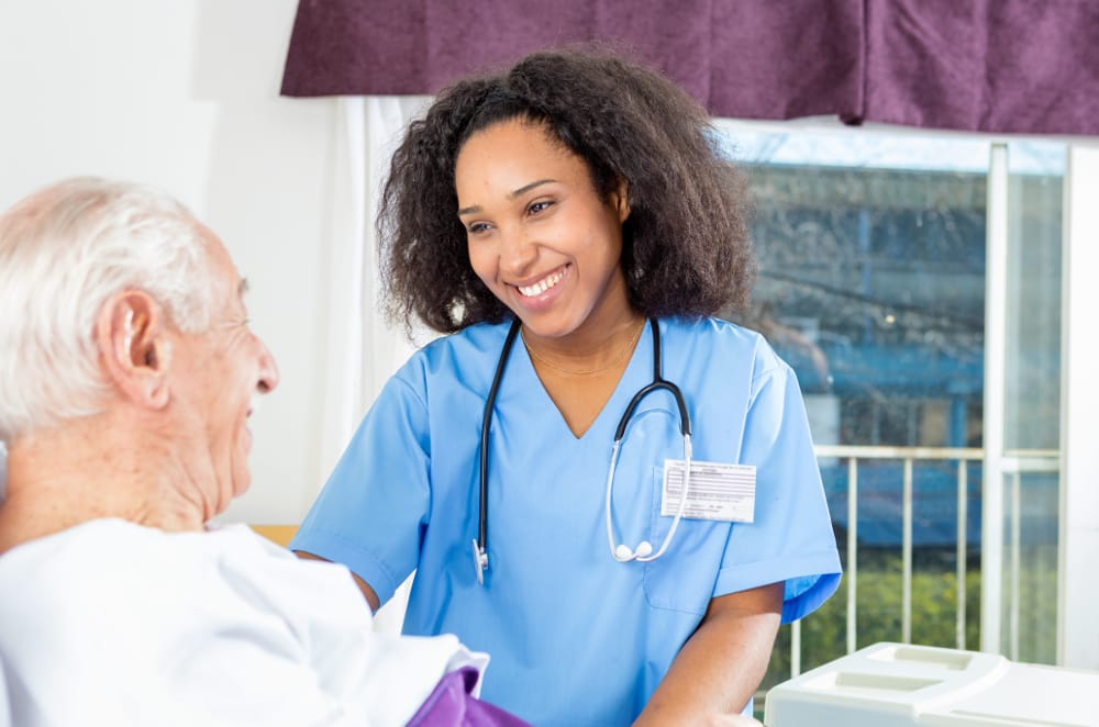 Nurse interacting with a senior resident