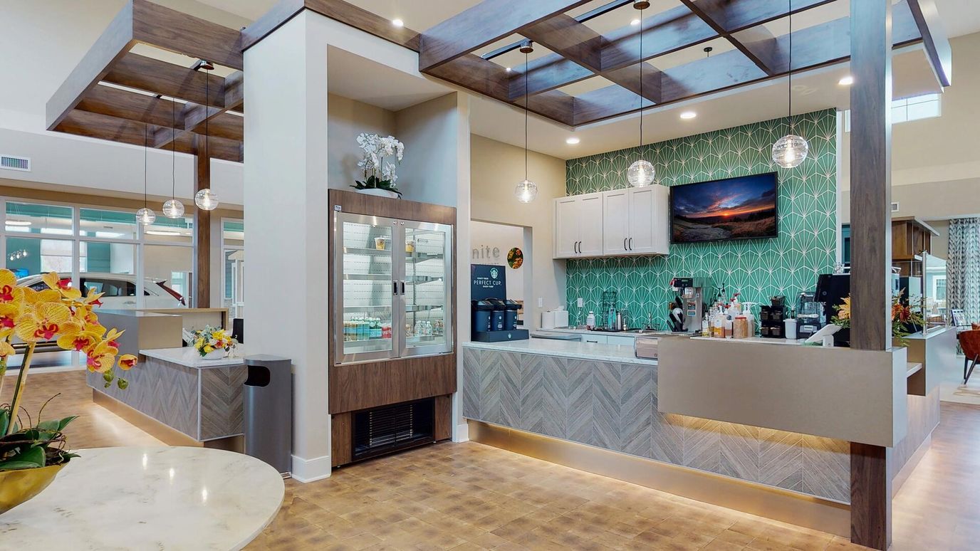 Modern interior of a common area with a coffee station.